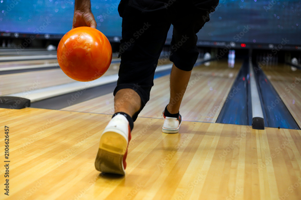Fototapeta premium Moment before player throws bowling ball to complete his turn. Horizontal format