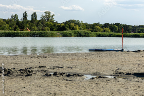 фотографія Peaceful lake with reeds and sandbar