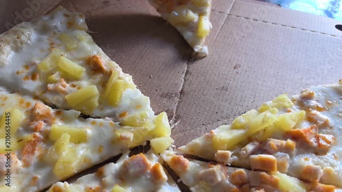 Watch as delicious homemade pizza is crafted with fresh ingredients. Each slice is loaded with gooey cheese and delightful toppings. Enjoy the process in a cozy kitchen setting.