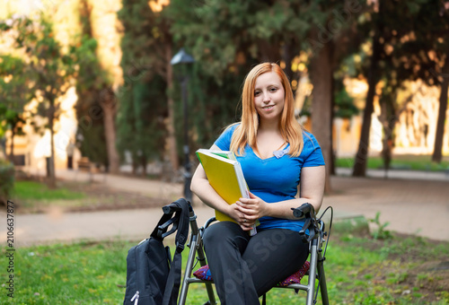 Obraz na płótnie Back to university concept with young college student using rollator on accessib