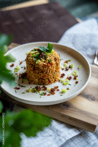 Homemade couscous with chicken and vegetables served on plate