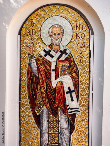 A mosaic depiction of Saint Nicholas, rendered with traditional gold and colorful tiles, offers a historical and reverent image for religious or educational content.