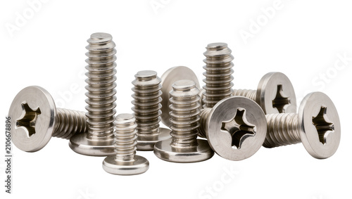 Fotografie Isolated group of shiny silver metal phillips head machine screws and fasteners