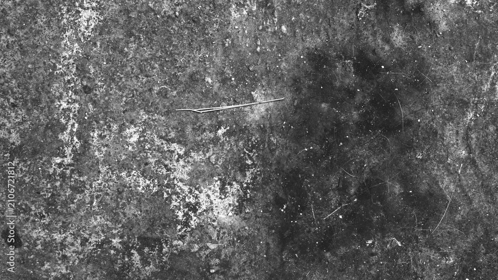 Obraz premium Black and white rough concrete texture with scattered marks and weathered details. Monochrome grunge background ideal for minimalist and abstract designs.