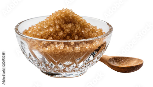 Fotografie Isolated bowl of natural brown sugar with a wooden spoon ready for sweetening fo
