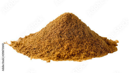Fotografi Isolated heap of aromatic light brown ground spice or unrefined sugar granules for cooking