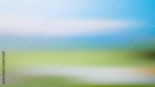 Foto Soft gradient sky blending into green field