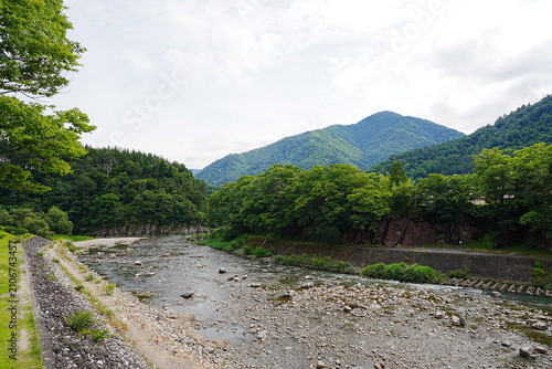 Photography Scenic View of the Clear Shogawa River and Mountains in Shirakawa-go, Gifu, Japa