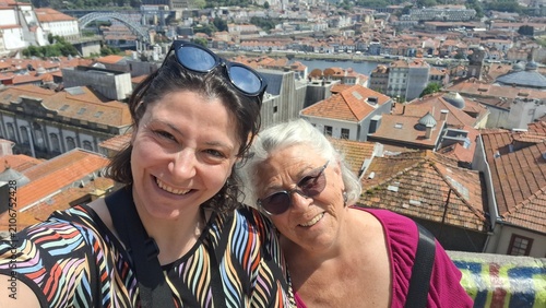 Mother and daughter taking a selfie on vacation in porto, portugal