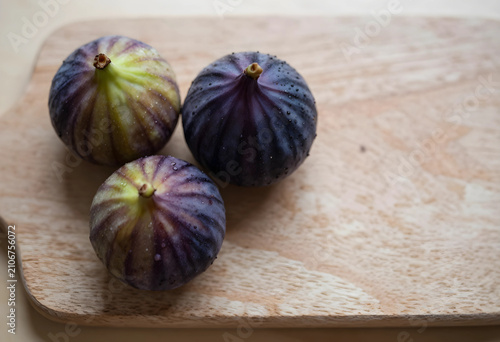 Three fresh ripe figs with ...