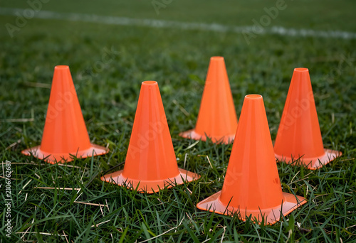 Five orange training cones ...