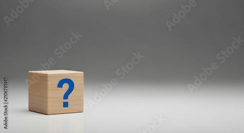 A Single Wooden Cube Featuring A Blue Question Mark Representing Business Uncertainty And Problem Solving On A Plain Minimalist Grey Studio Background