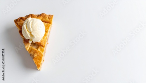 Delicious slice of apple tart topped with a scoop of creamy vanilla ice cream isolated on a white background