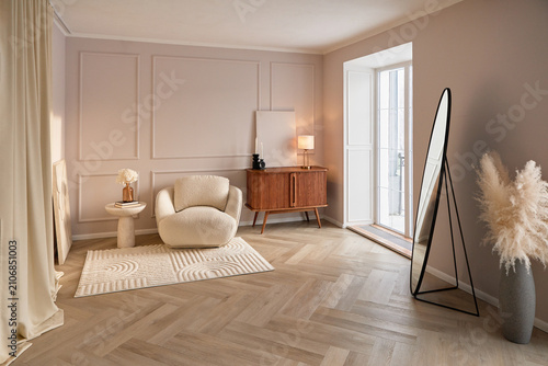A modern minimalist living room features a cozy boucle armchair, wooden sideboard, floor mirror, and soft neutral decor. Warm natural light fills the elegant interior, creating a calm home.