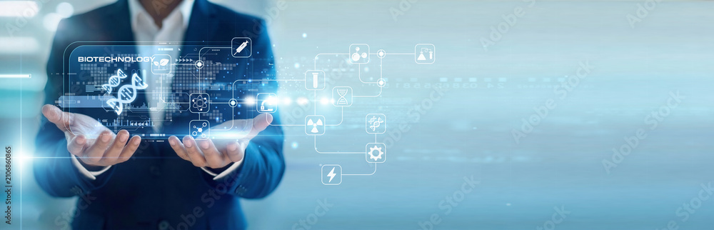 Obraz premium Medical researcher handhold virtual screen Biotechnology data while working on laptop for lab research. Genetic engineering and advanced molecular biology for healthcare breakthroughs.