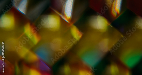 Cube glow. Blur geometric shape. Defocused yellow color shine lens flare glare flicker sparkle gleam on abstract light background.