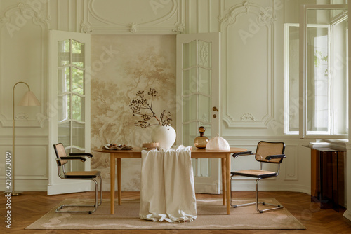 Elegant Living Space with Classic Design and Natural Light, Featuring a Wooden Table and Neutral Decor