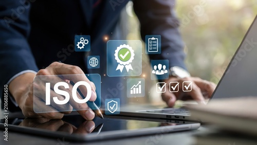 Person using tablet with digital iso certification and quality standard icons