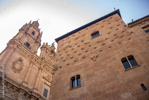 Casa de las Conchas and La Clerecía tower in Salamanca, Spain.