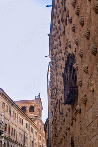 Angled perspective of Casa de las Conchas facade in Salamanca