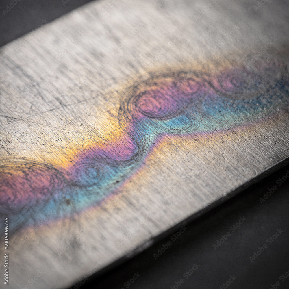 Fototapeta premium Iridescent Heat Tint Oxide Colors on Brushed Titanium Macro