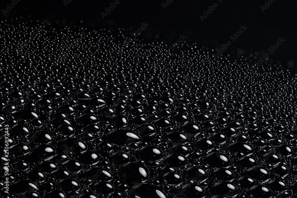 Obraz premium High-resolution close-up of water droplets on glossy black surface, ultra sharp, copy space, macro extreme detail ver.6