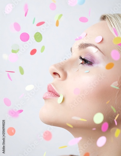 Woman's profile with falling confetti