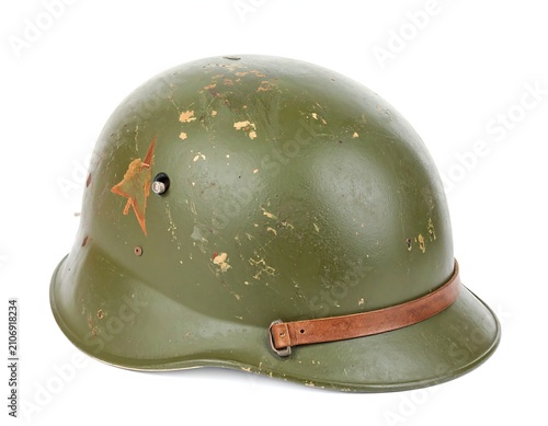 Worn olive drab military helmet with red star emblem