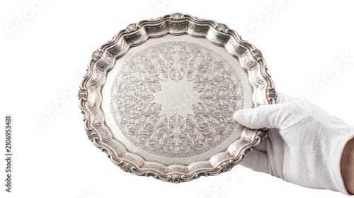 Obraz na plátne Round silver platter with complex floral engravings held by white gloved hand for professional catering