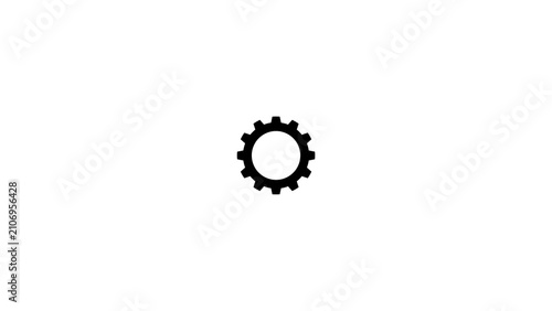 Фотография ingle black gear rotating smoothly on white background