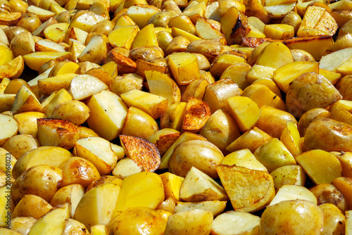 Freshly cut potatoes ready for roasting in a kitchen during the daytime
