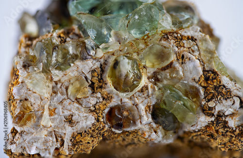 Mineral sample with green and brown crystals found in the Earth