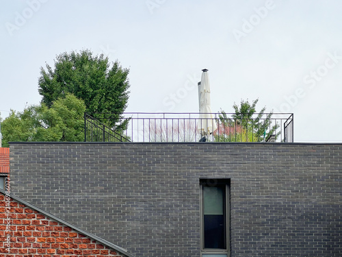 Photography TypicaI residential house exterior in urban South Korea, showing everyday urban living environment