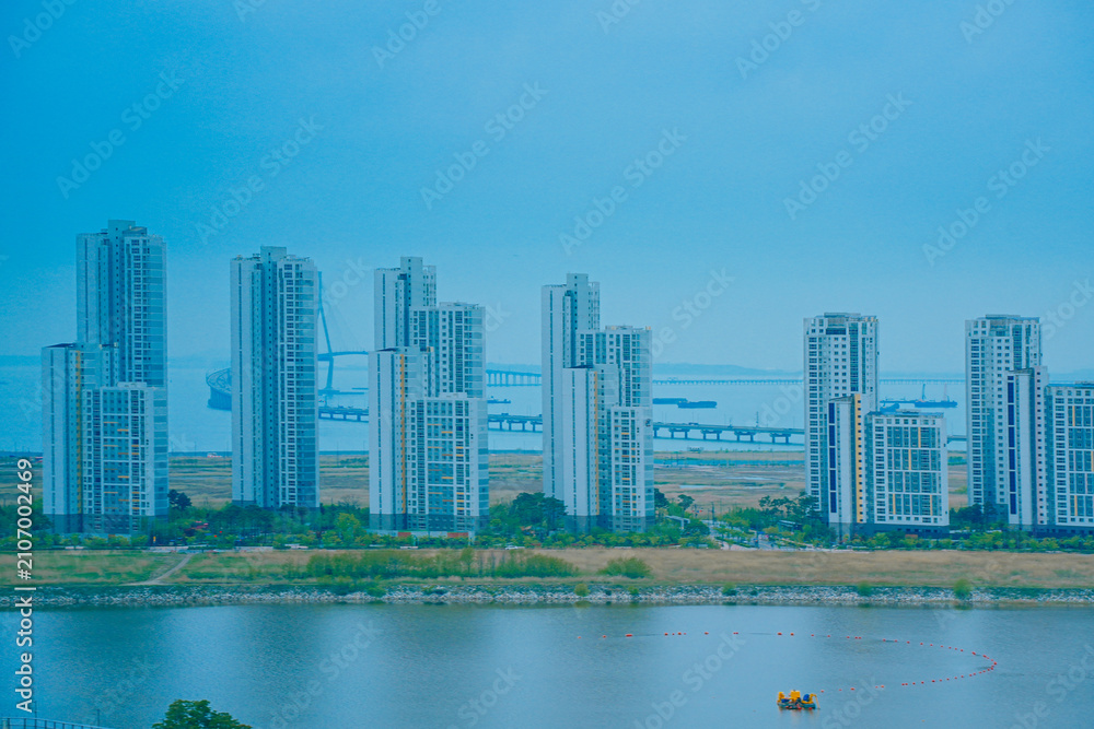 Fototapeta premium Songdo, Incheon, South Korea; 05 04 2025: The beautiful landscape of Songdo island International Business District (Songdo IBD) in South Korea. It is connected to Incheon airport