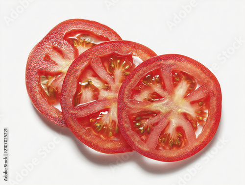 Photorealistic studio product photography of fresh red tomato slices with seeds, isolated on a clean white background with minimalist high-key lighting.