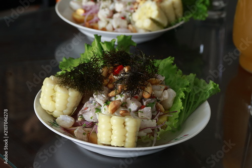 Traditional Peruvian ceviche served with corn, sweet potato and seaweed