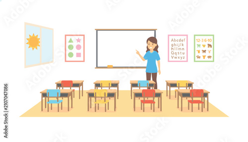 Empty school classroom with desks arranged in rows under a blackboard with colorful educational wall posters.