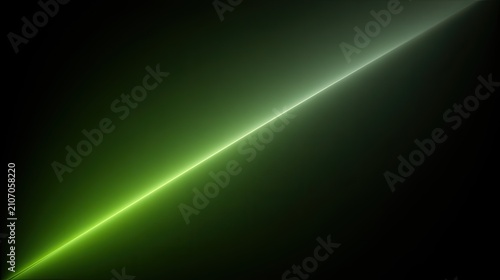 Diagonal luminous green light beam emanating from darkness