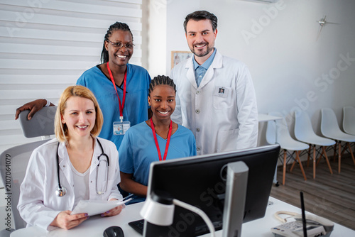 Billede på lærred Diverse medical team collaborating in modern office during workday