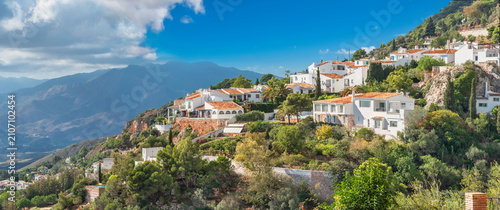 Scenic view of residential district with white houses on hillside in historic town of Mijas. Andalusia, Spain