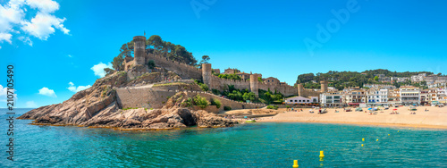 Scenic view of ancient fortress and shoreline with beach in Tossa de mar. Costa Brava, Catalonia, Spain