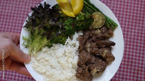 Healthy meal beef rice vegetables balanced nutrition combines grilled beef steamed rice broccoli asparagus fresh salad and peach for wholesome eating daily