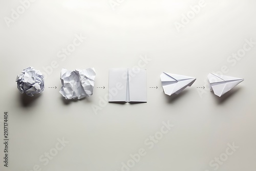 Transforming Crumpled Paper Into Flying Paper Airplane Step by Step Process