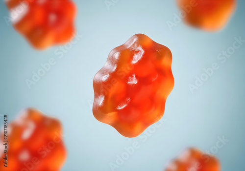 Floating orange gummy candy close up vibrant confectionery with translucent texture against soft blue background