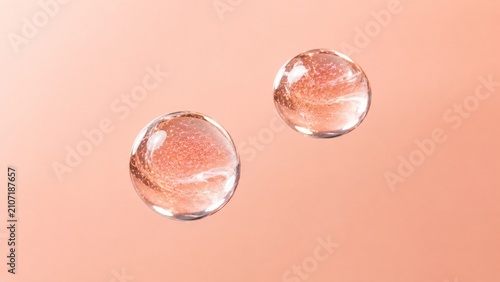 Transparent Cosmetic Serum Gel Bubbles on Soft Peach Background