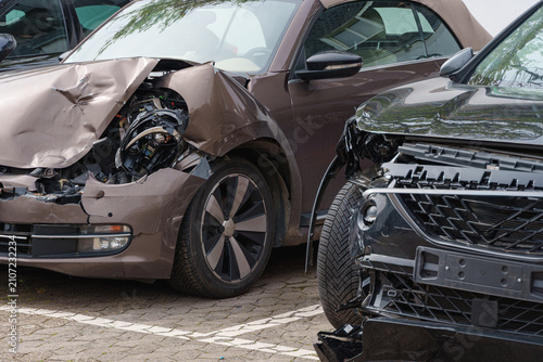 фотографія Two heavily damaged passenger cars after a collision parked for insurance assess