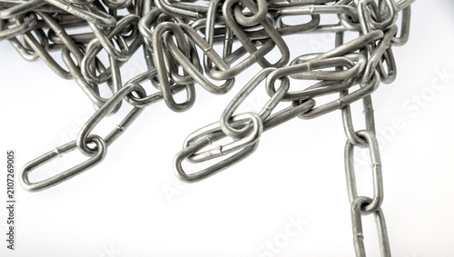 Принти на полотні A pile of silver metal chains on a white background