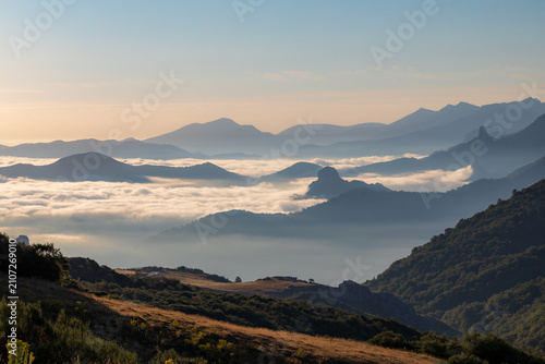 View of the mist-shrouded valleys and mountains of the Picos de Europa from the Collado de Llesba viewpoint, Cantabria, Spain