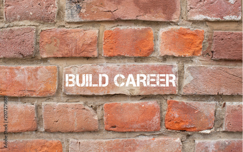 Fotografie Build career text painted on brick wall