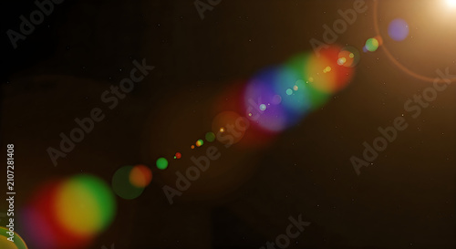 Obraz na płótnie Chromatic lens flare overlay vibrant rainbow streaks on dark background for cine